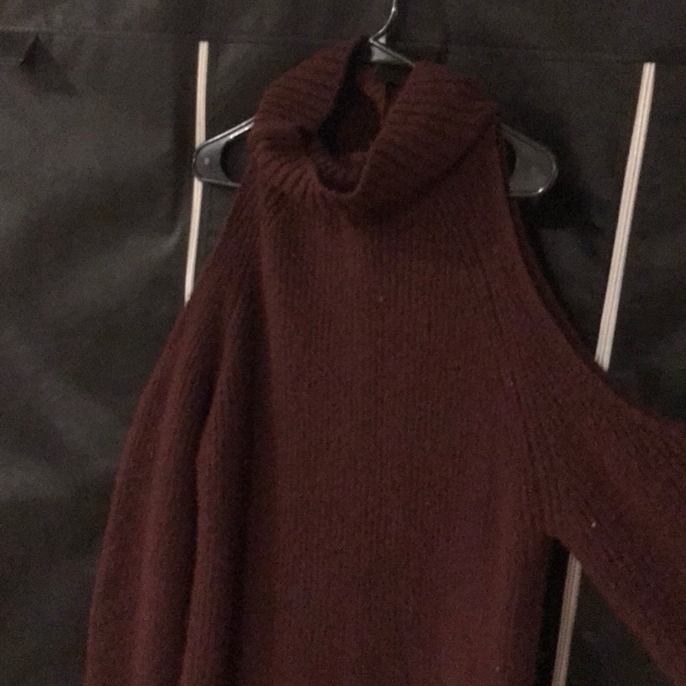 Cold shoulder turtleneck sweater.
